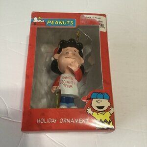 Peanuts Lucy Holiday Ornament Lucy in a “Santa Security Team” T-shirt